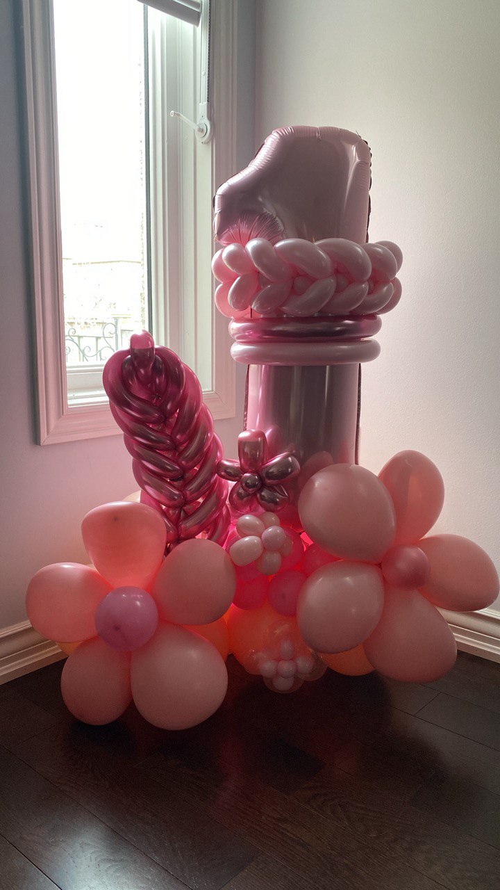 A birthday number with a chain, leaf, and cute flowers decoration.