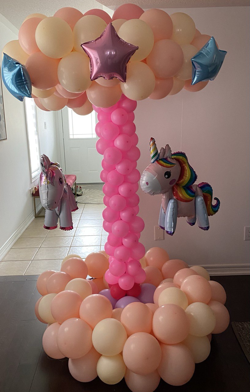 A cute balloon carousel for a birthday gift.